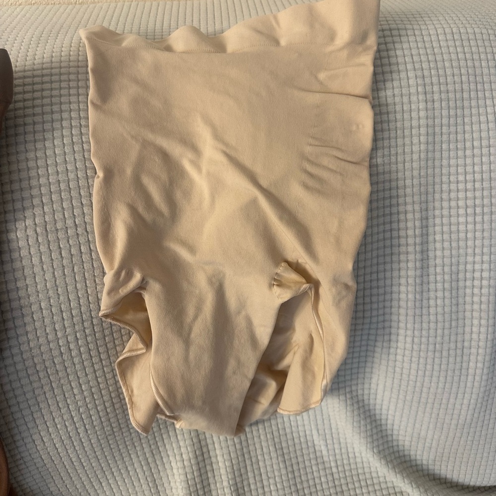 SKIMS Cream Shapewear with High-Waisted Design